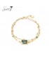 Armband goudkleurig met marmerlook groene steen en hartje