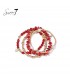 Armband met rode kralen en goudkleurige accenten