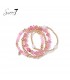 Armbanden set in roze met pareltjes en goudkleurige accenten