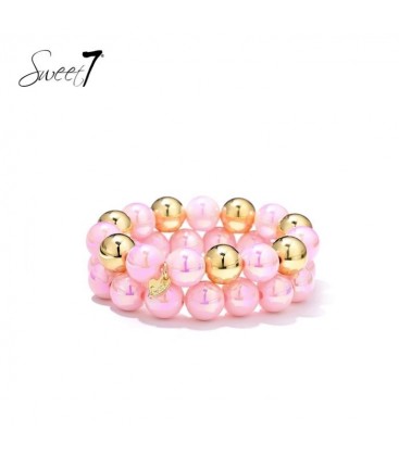 Armband set met roze kralen en goudkleurige details
