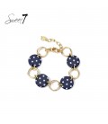 Armband met donkerblauwe schijfjes, stippen en goudkleurige schakels.