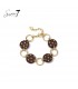 Armband bruin met stippen en goudkleurige schakels