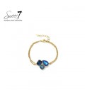 Armband met blauwe kristallen en goudkleurige schakel